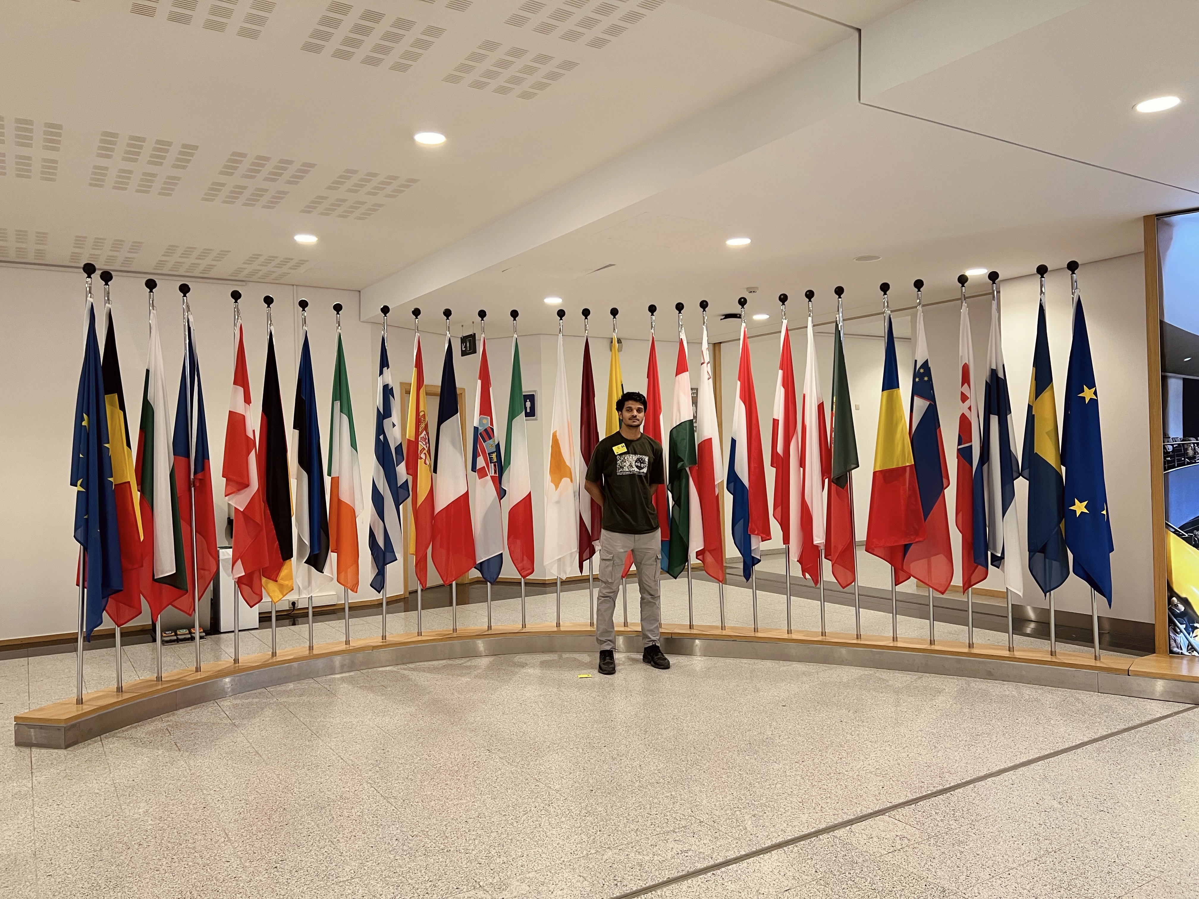 Founder Shahinsha standing in front of EU Parliament Belgium